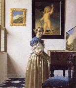JanVermeer A Young Woman Standing at a Virginal oil painting